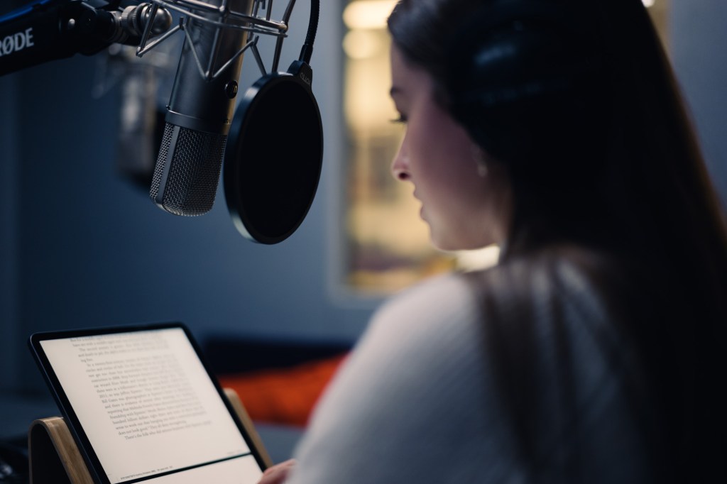 Colleague recording audio footage